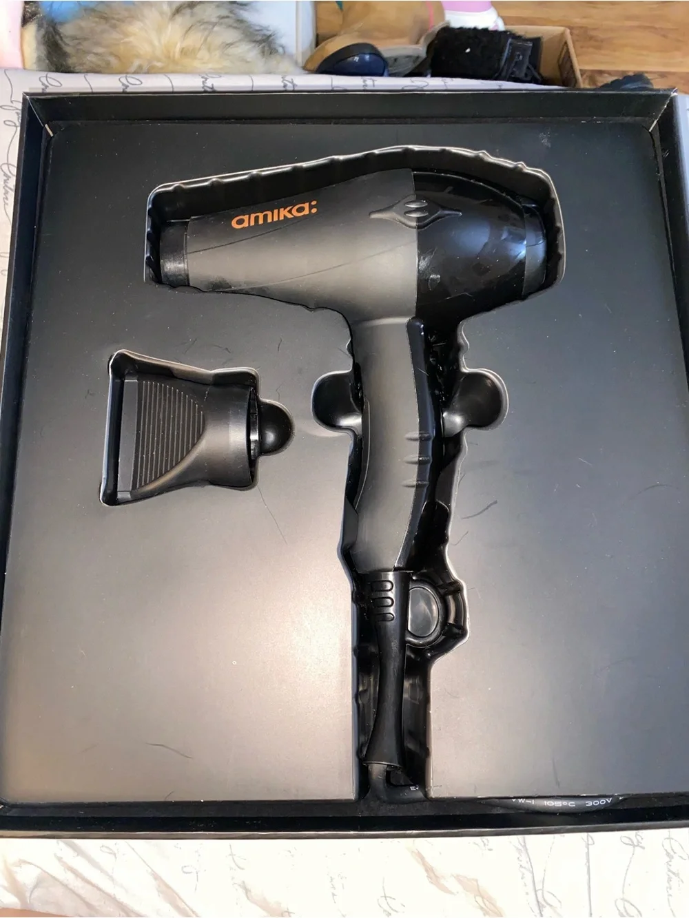 amika Black Professional Hair Dryer with Orange Logo